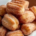 Golden and crispy Air Fryer Churro Bites coated in cinnamon sugar