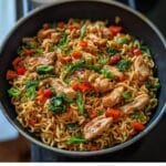 Chicken Ramen Stir Fry in skillet with vegetables and soy glaze