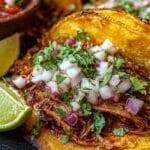 Crock Pot Birria Tacos served with lime wedges and fresh onion