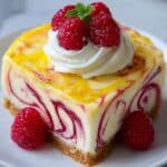Lemon raspberry swirl cheesecake with a creamy swirl pattern