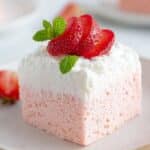 Strawberry Cloud Cake with whipped topping and fresh strawberries