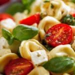 Tortellini Caprese Pasta Salad with cherry tomatoes, mozzarella, and basil