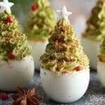 Deviled Egg Christmas Trees appetizer decorated with parsley and paprika