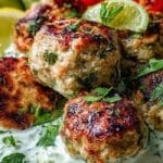 Juicy Greek Chicken Meatballs with Tzatziki served with lime and herbs