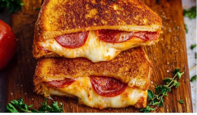 Close-up of Pizza Grilled Cheese with melted cheese and pepperoni on golden toasted bread