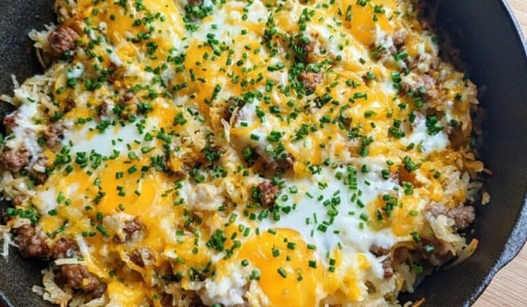 Breakfast Hot Mess Express skillet with eggs, sausage, cheddar, and chives