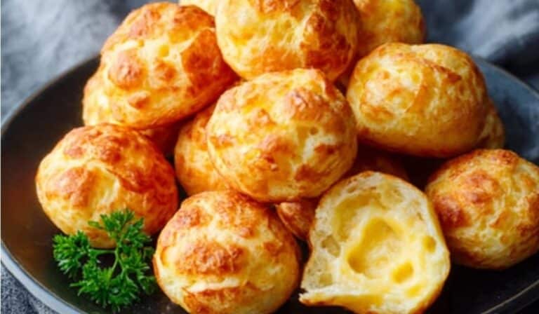 Gougères (French Cheese Puffs) golden brown and airy on a plate