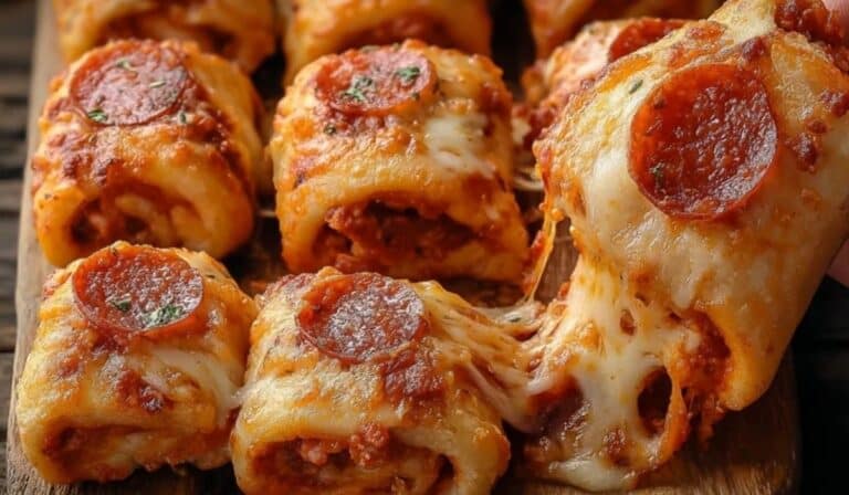 High Protein and Low Calorie Pepperoni Pizza Rolls baked to golden perfection on a wooden board