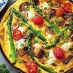 Featured image of Spring Vegetable Frittata with asparagus, tomatoes, and mushrooms