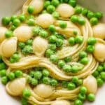 One-pot Pasta with Peas served in a rustic bowl with whole peas and shell pasta