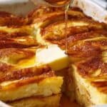 Pancake Breakfast Casserole in baking dish with golden top and maple syrup drizzle