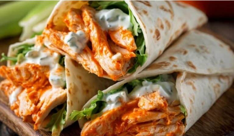 Buffalo Chicken Wraps filled with spicy shredded chicken, lettuce, and creamy dressing
