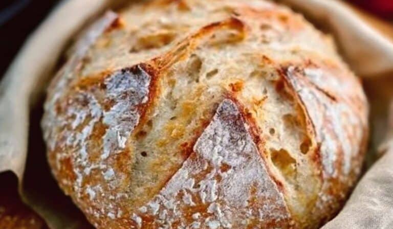 Freshly baked Dutch Oven No Knead Bread with golden crust