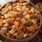 Best Chex Mix Recipe served in a rustic wooden bowl