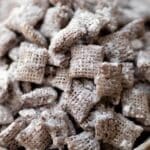 Featured image of Homemade Muddy Buddies Chex Mix in a festive bowl