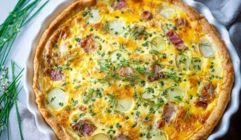 Loaded Baked Potato Quiche fresh out of the oven with crispy bacon and herbs