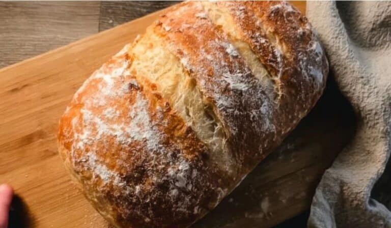 World Easiest Homemade Bread on rustic cutting board
