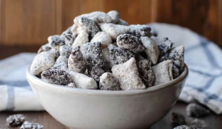 Featured Cookies and Cream Puppy Chow served in a white bowl