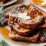 Easiest Gingerbread French Toast served with cranberries and holiday garnish