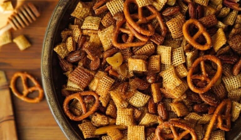 Bowl of Honey Mustard Chex Mix on rustic table