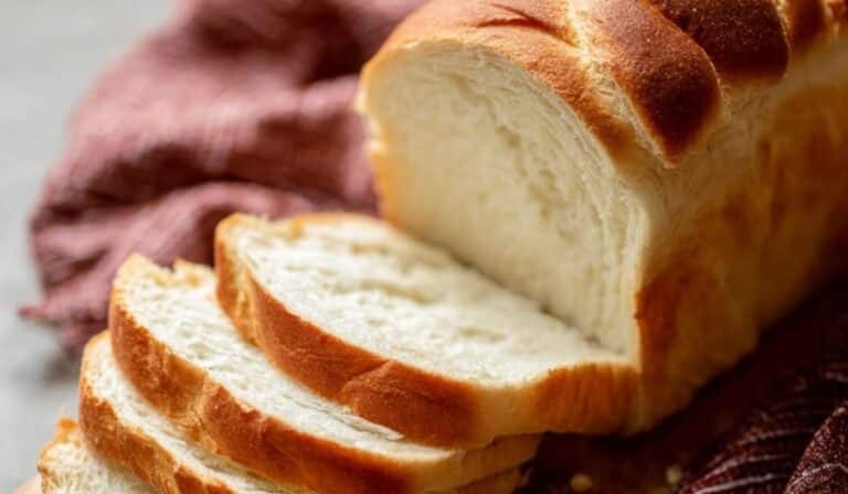 Simply Sandwich Bread served sliced on a board