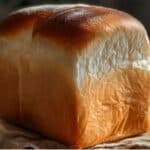 Simple Homemade Milk Bread Recipe – golden brown loaf on parchment