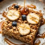 Banana Baked Oatmeal slice on rustic plate