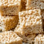 Family-Favorite Rice Krispie Treats stacked on wooden plate