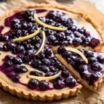 Top-down view of a lemon blueberry tart elegantly sliced
