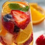 Sparkling Champagne Sangria served in a crystal glass