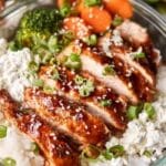Chicken and rice meal prep bowls with roasted vegetables and lemon yogurt sauce
