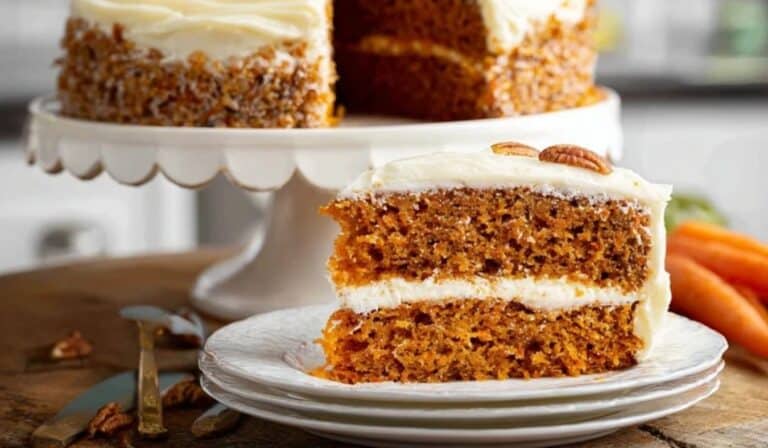 Classic carrot cake with cream cheese frosting on a cake stand