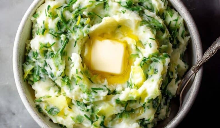 Creamy colcannon Irish mashed potato in a bowl with melting butter
