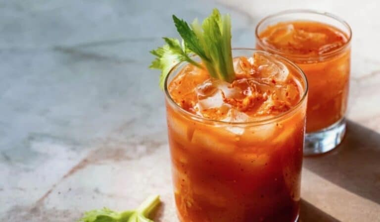 Kimchi cocktail mixer base served over ice with a spicy kimchi garnish