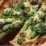 Spring vegetable quiche with asparagus and peas in a golden flaky crust